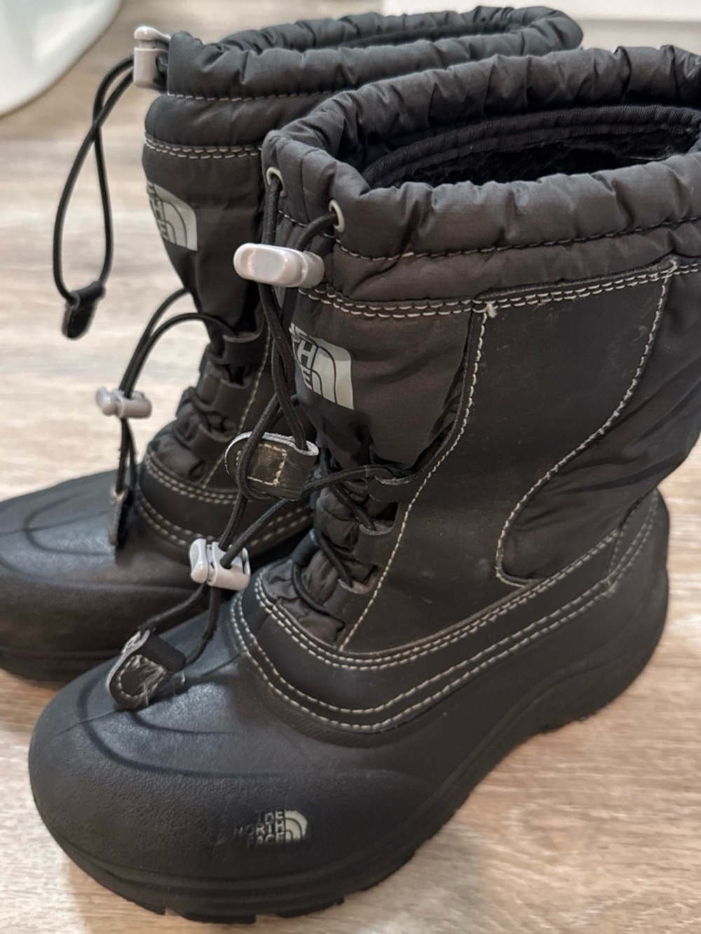 The North Face Kids Black Insulated Snow Boots with Bungee Closure